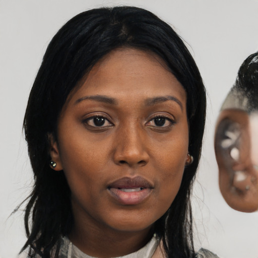 Neutral black young-adult female with medium  black hair and brown eyes