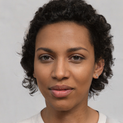 Joyful latino young-adult female with medium  black hair and brown eyes