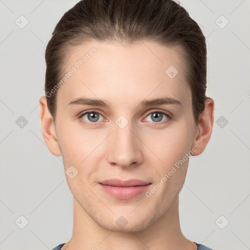 Joyful white young-adult female with short  brown hair and grey eyes