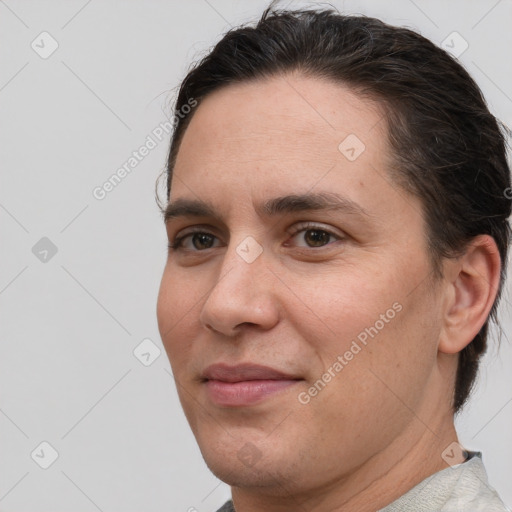 Joyful white adult male with short  brown hair and brown eyes