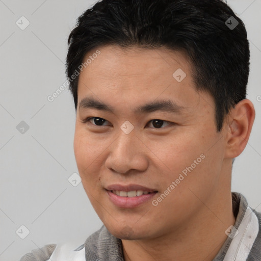 Joyful white young-adult male with short  black hair and brown eyes