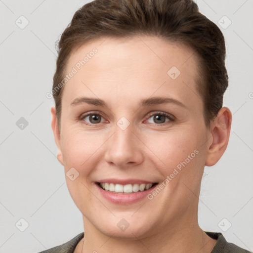 Joyful white young-adult female with short  brown hair and grey eyes