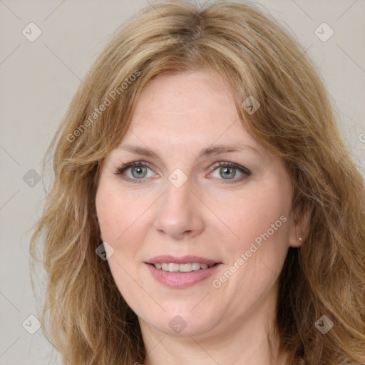 Joyful white adult female with medium  brown hair and green eyes