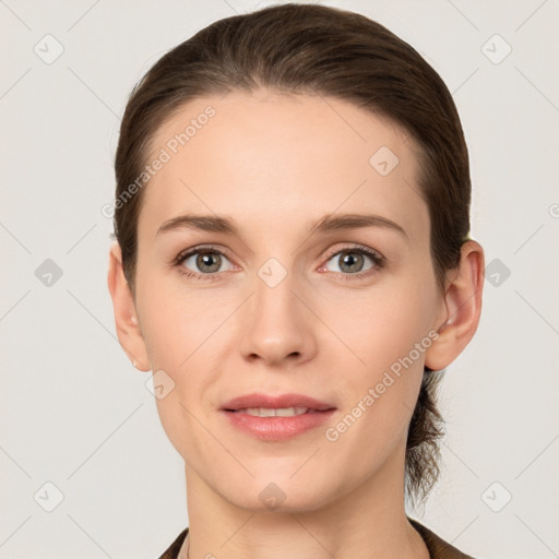 Joyful white young-adult female with short  brown hair and grey eyes