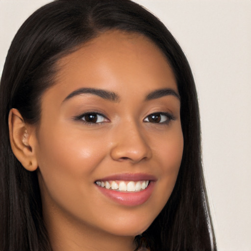 Joyful latino young-adult female with long  brown hair and brown eyes