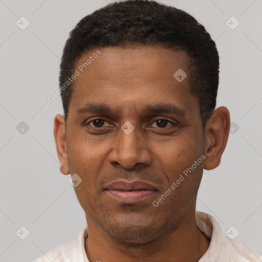 Joyful latino adult male with short  black hair and brown eyes