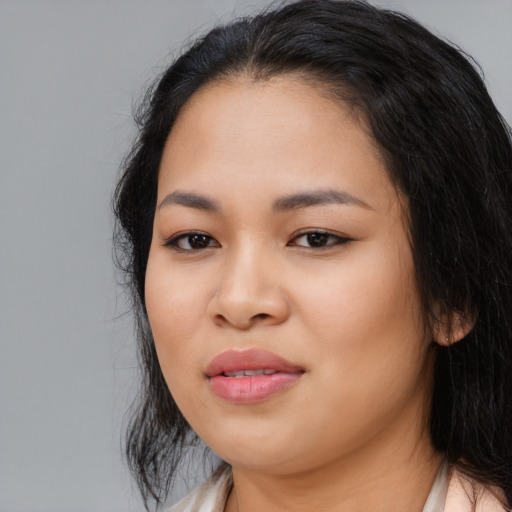 Joyful asian young-adult female with medium  black hair and brown eyes