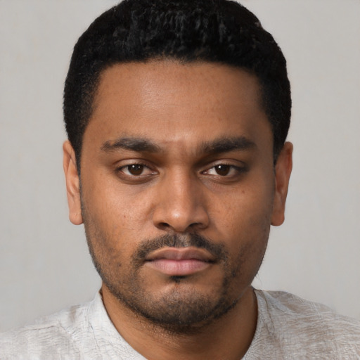 Neutral latino young-adult male with short  black hair and brown eyes