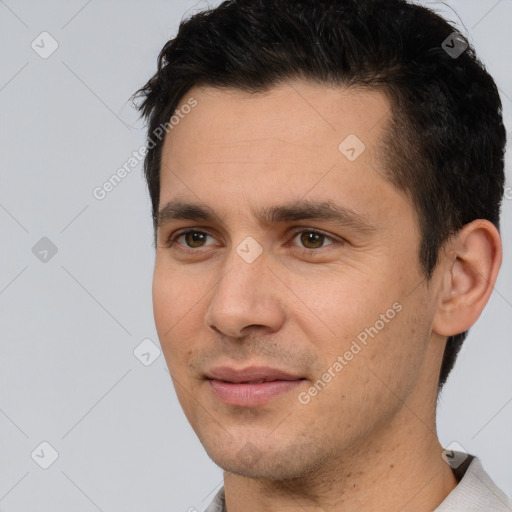 Joyful white young-adult male with short  brown hair and brown eyes