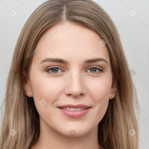 Joyful white young-adult female with long  brown hair and grey eyes