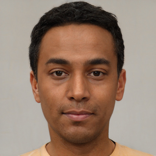 Neutral latino young-adult male with short  black hair and brown eyes