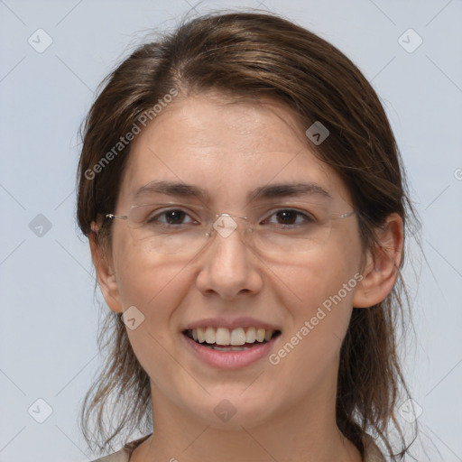 Joyful white adult female with medium  brown hair and brown eyes