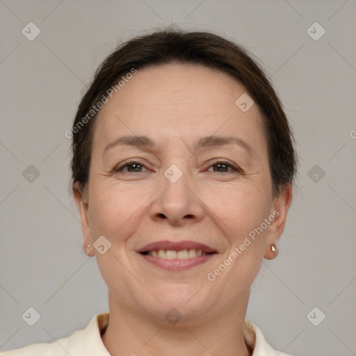 Joyful white adult female with short  brown hair and brown eyes