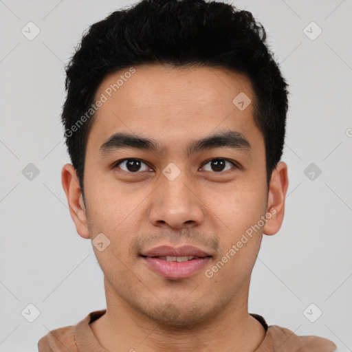 Joyful latino young-adult male with short  black hair and brown eyes