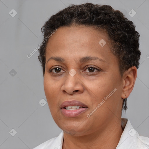 Joyful black adult female with short  brown hair and brown eyes