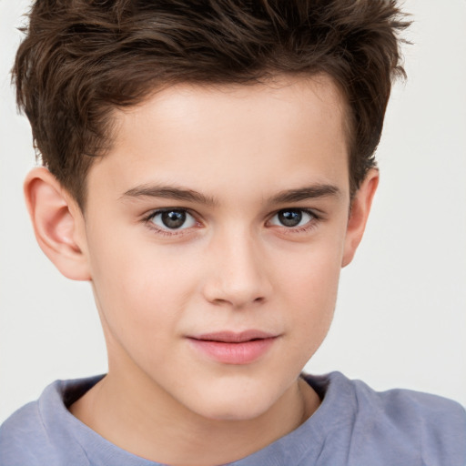 Joyful white child male with short  brown hair and brown eyes