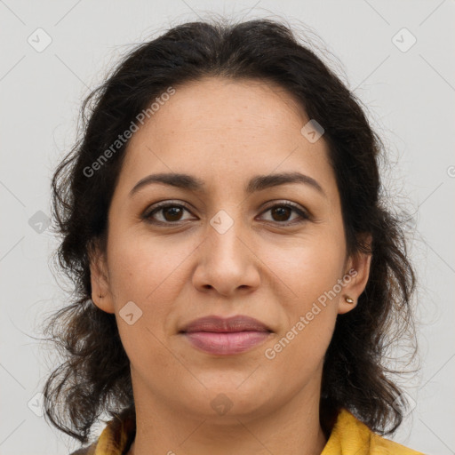 Joyful latino young-adult female with medium  brown hair and brown eyes