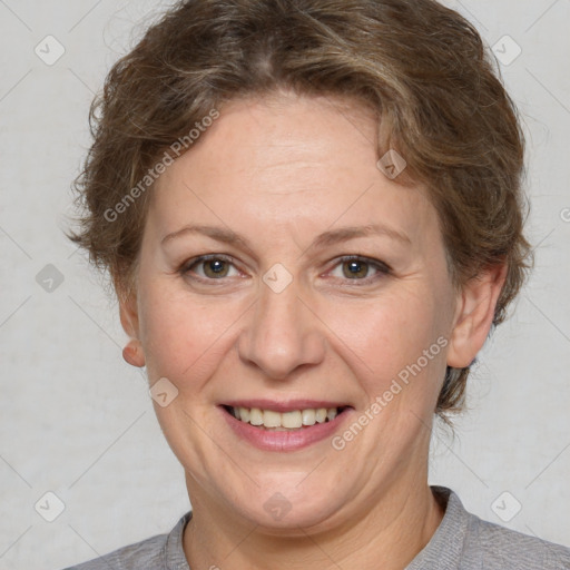 Joyful white adult female with short  brown hair and brown eyes