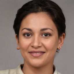 Joyful white adult female with short  brown hair and brown eyes