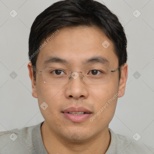 Joyful asian young-adult male with short  brown hair and brown eyes