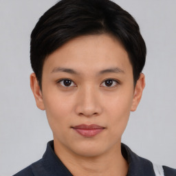 Joyful asian young-adult female with short  black hair and brown eyes