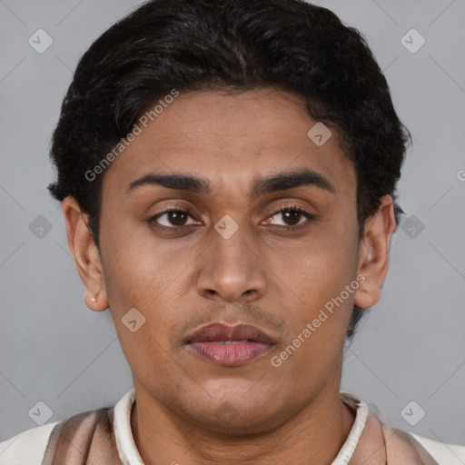 Joyful latino young-adult male with short  brown hair and brown eyes