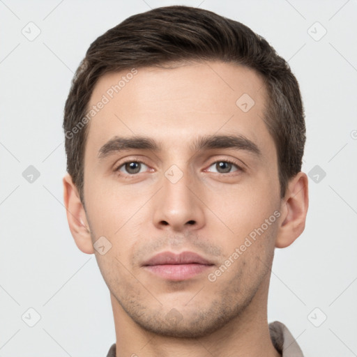 Neutral white young-adult male with short  brown hair and brown eyes