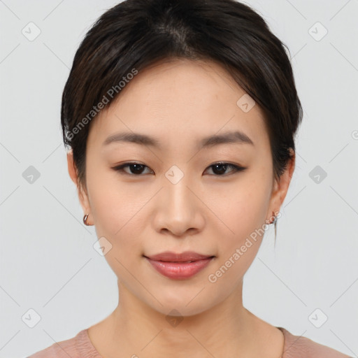 Joyful asian young-adult female with short  black hair and brown eyes