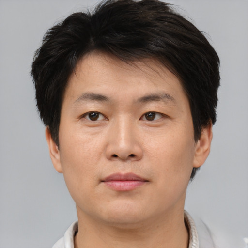 Neutral asian young-adult male with short  brown hair and brown eyes
