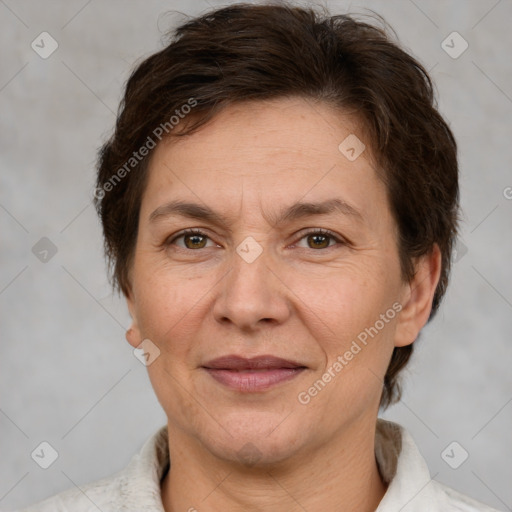 Joyful white adult female with short  brown hair and brown eyes