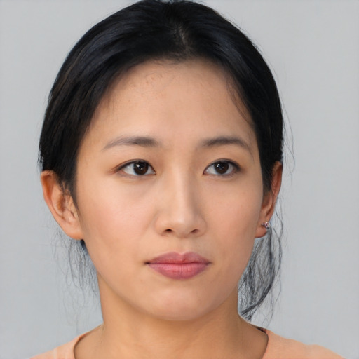 Neutral asian young-adult female with medium  black hair and brown eyes