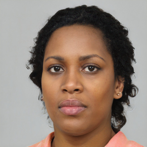 Neutral black young-adult female with long  black hair and brown eyes