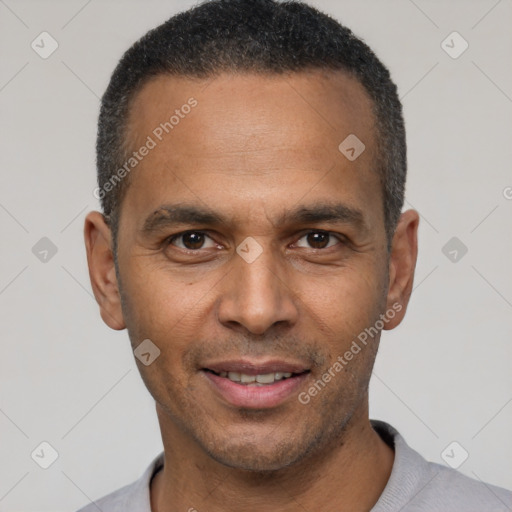 Joyful latino adult male with short  black hair and brown eyes