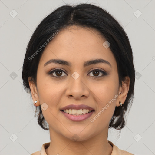 Joyful latino young-adult female with medium  brown hair and brown eyes