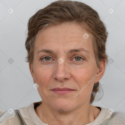 Joyful white adult female with short  brown hair and grey eyes