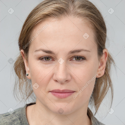 Joyful white young-adult female with medium  brown hair and blue eyes