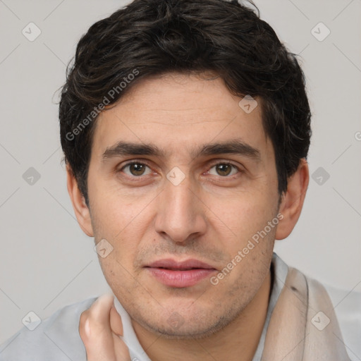 Joyful white adult male with short  brown hair and brown eyes