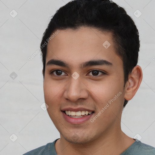 Joyful latino young-adult male with short  black hair and brown eyes