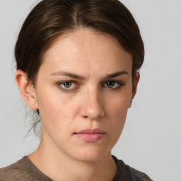 Neutral white young-adult female with short  brown hair and brown eyes