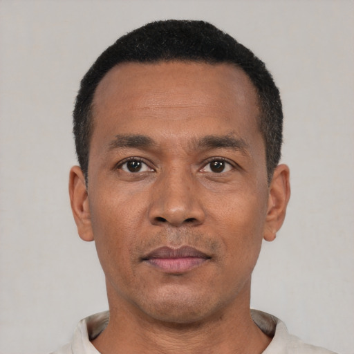 Neutral black adult male with short  black hair and brown eyes