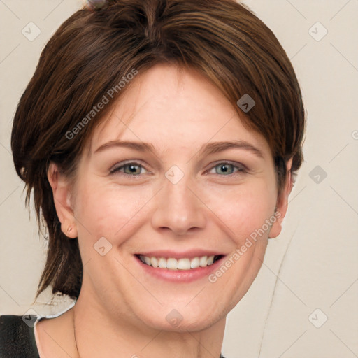 Joyful white young-adult female with short  brown hair and grey eyes