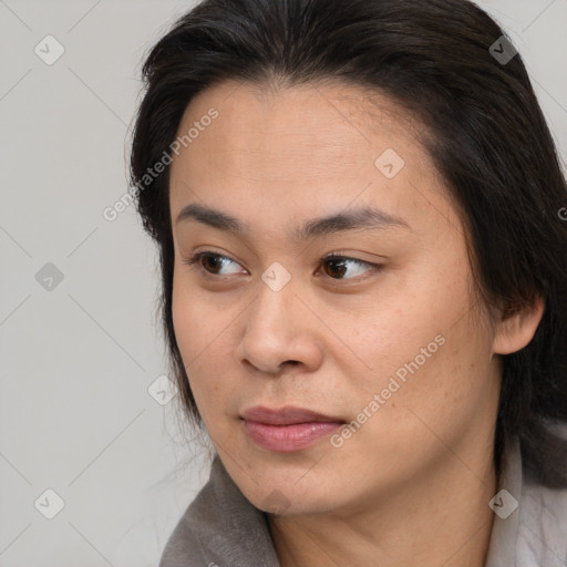 Neutral white young-adult female with long  brown hair and brown eyes