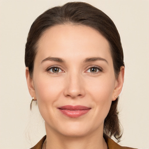 Joyful white young-adult female with medium  brown hair and brown eyes