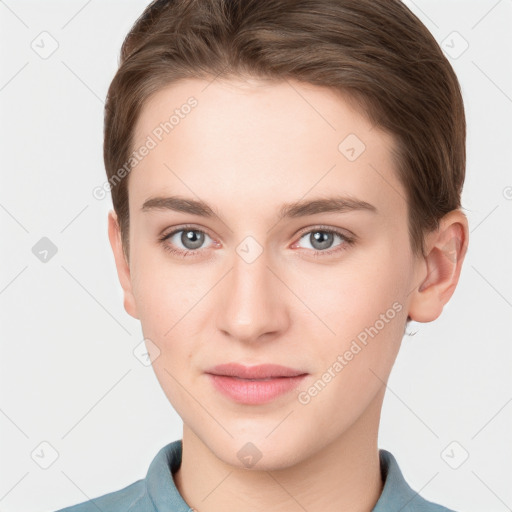 Joyful white young-adult female with short  brown hair and grey eyes