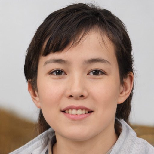 Joyful white child female with medium  brown hair and brown eyes