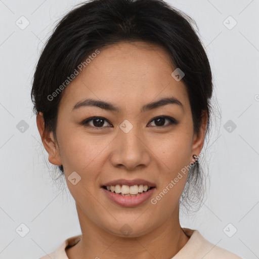 Joyful asian young-adult female with short  brown hair and brown eyes