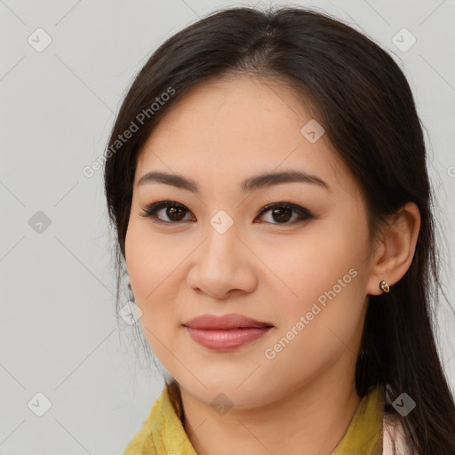 Joyful asian young-adult female with long  brown hair and brown eyes