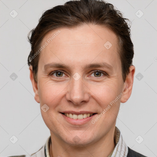 Joyful white adult female with short  brown hair and grey eyes