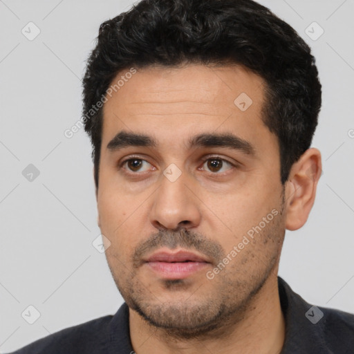 Neutral latino young-adult male with short  black hair and brown eyes