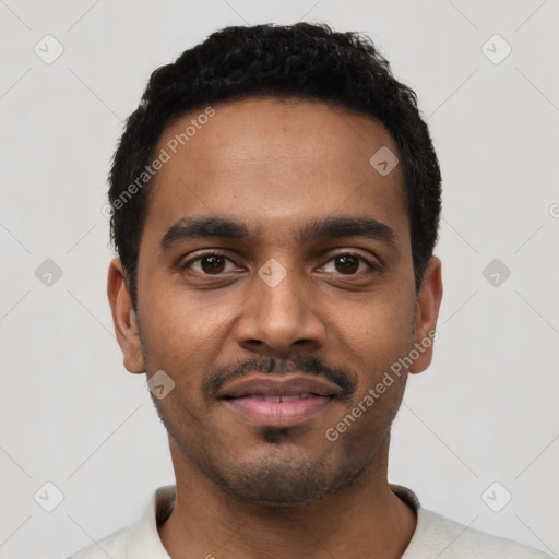 Joyful black young-adult male with short  black hair and brown eyes